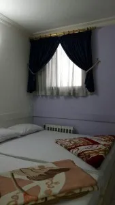 اتاق هتل آپارتمان مهرگان مشهد